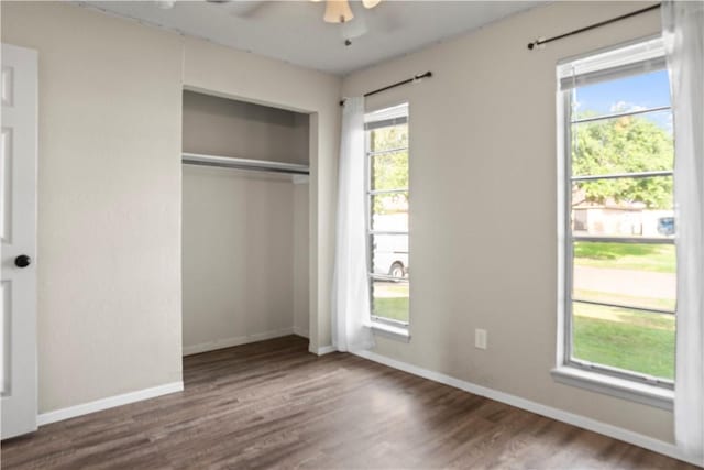 2809 Vancouver Dr, Corpus Christi, TX 78414 - unfurnished bedroom featuring wood finished floors, a closet, baseboards, and ceiling fan