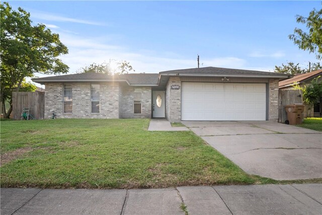 2809 Vancouver Dr, Corpus Christi, TX 78414 - view of front of property featuring driveway, an attached garage, and brick siding