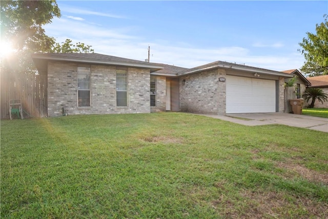 2809 Vancouver Dr, Corpus Christi, TX 78414 - view of front of house with a garage, driveway, a front yard, and brick siding