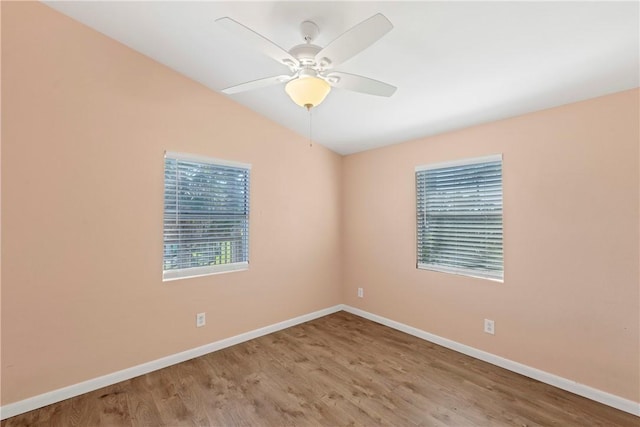 unfurnished room with ceiling fan, lofted ceiling, and light hardwood / wood-style flooring