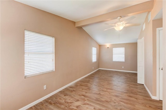 unfurnished room featuring vaulted ceiling with beams, ceiling fan, and light wood-type flooring