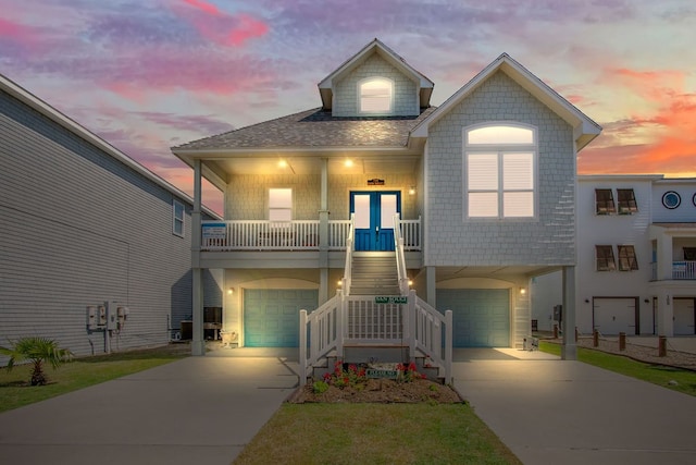 view of front of property featuring a garage and a porch