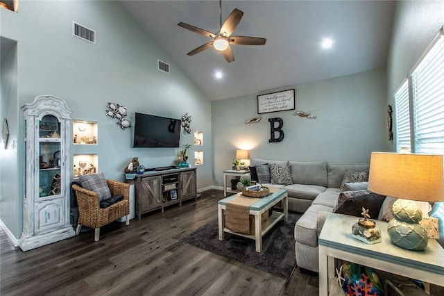 living area with high vaulted ceiling, dark wood-style flooring, visible vents, and ceiling fan