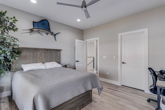 bedroom featuring light wood finished floors, recessed lighting, a ceiling fan, and baseboards