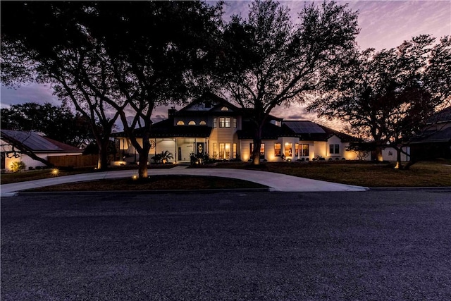 view of front of home featuring roof mounted solar panels