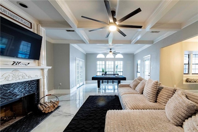 living area featuring marble finish floor, coffered ceiling, a fireplace, and beamed ceiling