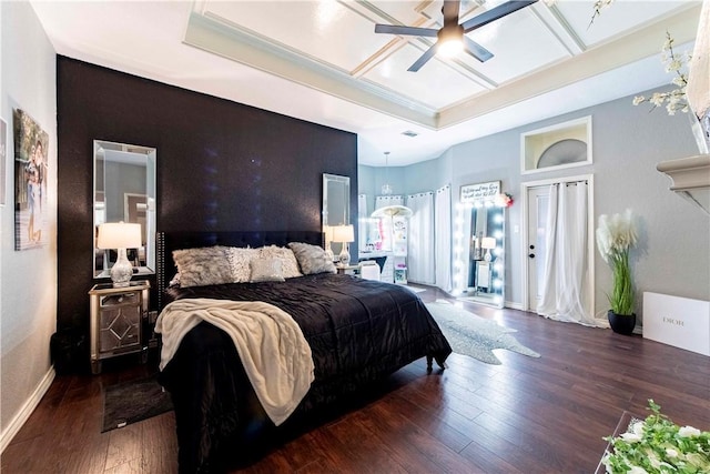 bedroom featuring hardwood / wood-style flooring, ceiling fan, baseboards, and coffered ceiling