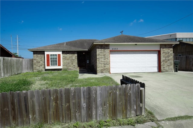 2033 Briarwood Dr, Corpus Christi, TX 78412 - ranch-style house featuring brick siding, driveway, and an attached garage