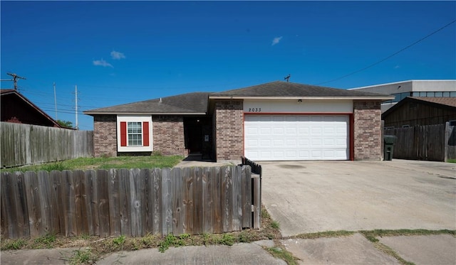 2033 Briarwood Dr, Corpus Christi, TX 78412 - ranch-style home featuring brick siding, an attached garage, and concrete driveway