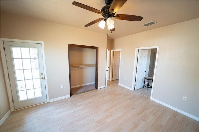 2033 Briarwood Dr, Corpus Christi, TX 78412 - unfurnished bedroom with light wood-style floors, multiple windows, a closet, and a ceiling fan