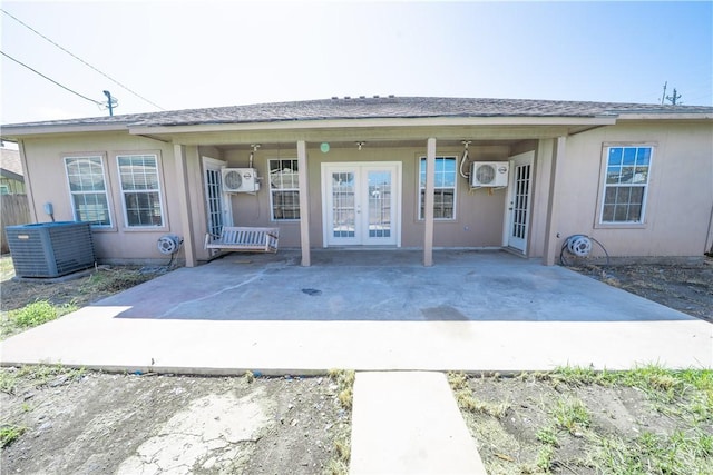 2033 Briarwood Dr, Corpus Christi, TX 78412 - rear view of house with french doors, a patio area, and a wall mounted AC