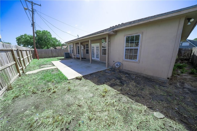2033 Briarwood Dr, Corpus Christi, TX 78412 - rear view of property with french doors, a fenced backyard, and a patio area