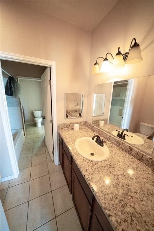2033 Briarwood Dr, Corpus Christi, TX 78412 - bathroom featuring vanity, tile patterned floors, and washtub / shower combination