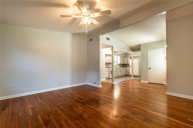 5933 Lucille Dr, Corpus Christi, TX 78412 - unfurnished living room with a ceiling fan, vaulted ceiling, and dark wood-type flooring