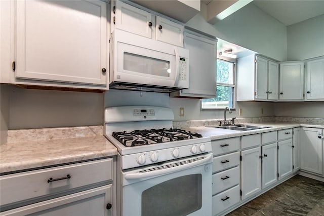 5933 Lucille Dr, Corpus Christi, TX 78412 - kitchen with white appliances, light countertops, and white cabinets