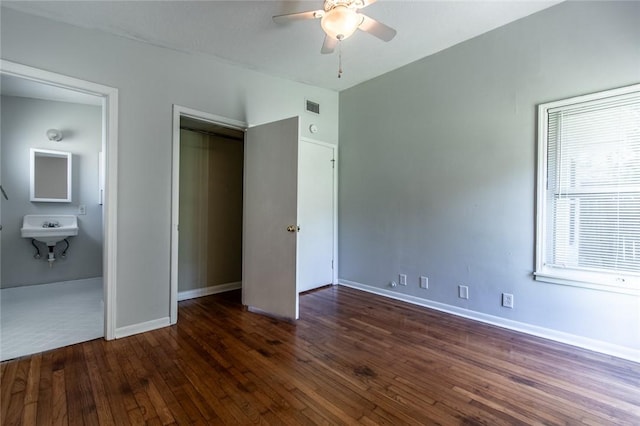 5933 Lucille Dr, Corpus Christi, TX 78412 - unfurnished bedroom featuring wood-type flooring, a closet, and a ceiling fan