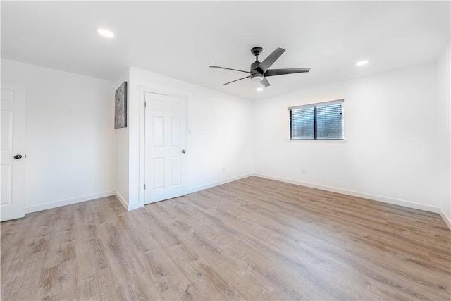 empty room with ceiling fan, baseboards, wood finished floors, and recessed lighting