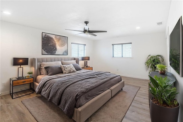 bedroom with recessed lighting, visible vents, ceiling fan, light wood-type flooring, and baseboards