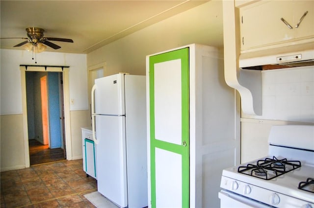 201 S Alta Vista St, Beeville, TX 78102 - kitchen featuring white appliances, ceiling fan, stone finish floors, and under cabinet range hood