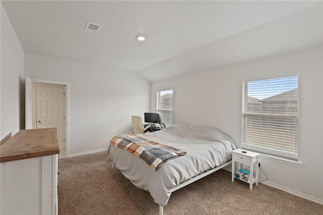 bedroom with carpet flooring and vaulted ceiling