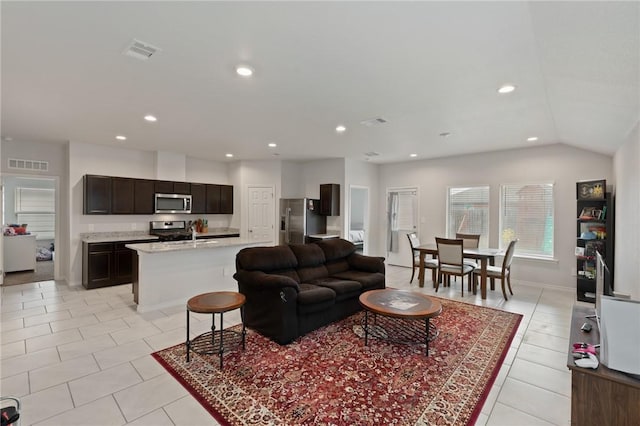 tiled living room with lofted ceiling