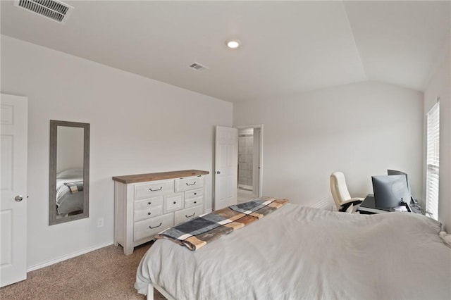 bedroom featuring lofted ceiling and light colored carpet