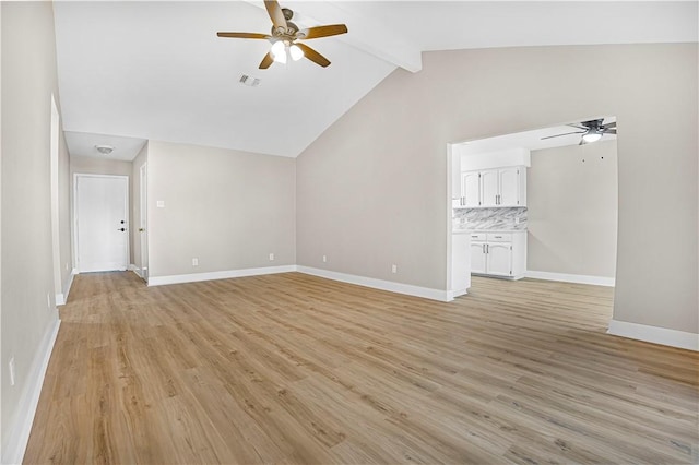 unfurnished living room with vaulted ceiling with beams, light wood-style flooring, visible vents, and baseboards