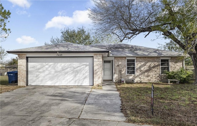 ranch-style home with driveway and an attached garage