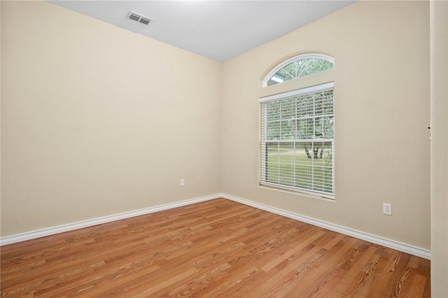 unfurnished room featuring light hardwood / wood-style floors