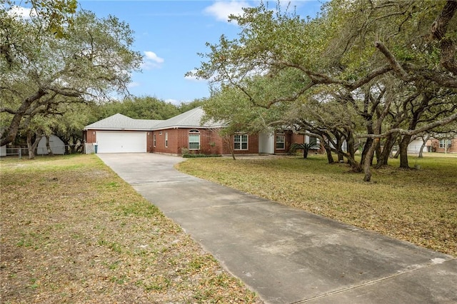 single story home with a garage and a front yard