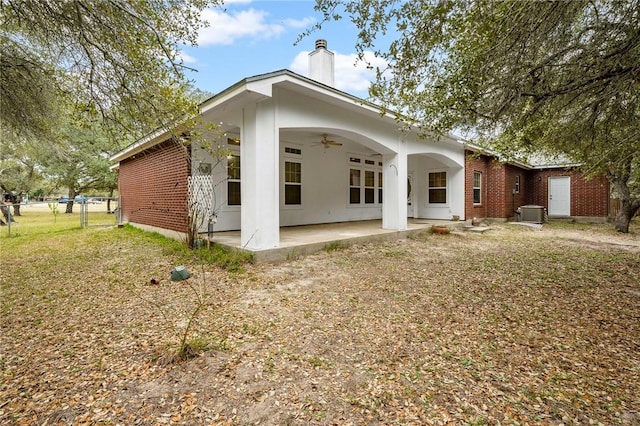 back of house with ceiling fan, a yard, a patio, and central air condition unit