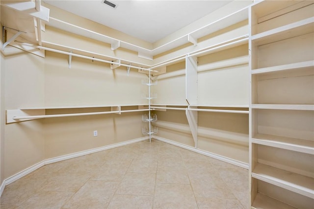 spacious closet featuring tile patterned floors