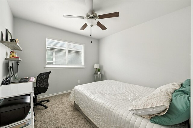 6758 Mikayla St, Corpus Christi, TX 78413 - carpeted bedroom with ceiling fan and a desk