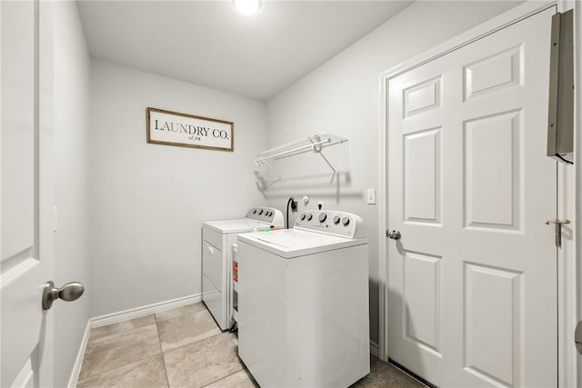 6758 Mikayla St, Corpus Christi, TX 78413 - laundry area with washing machine and dryer and light tile patterned flooring