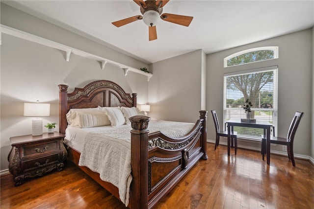 bedroom featuring dark hardwood / wood-style flooring and ceiling fan