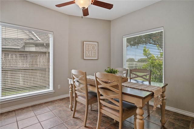 tiled dining area with ceiling fan