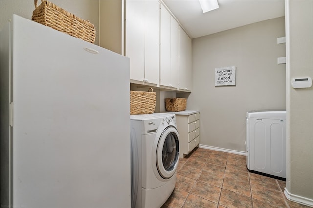 laundry room with cabinets and separate washer and dryer