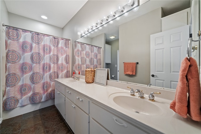 bathroom with walk in shower and vanity