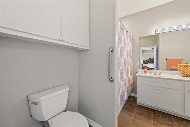 bathroom with toilet and vanity