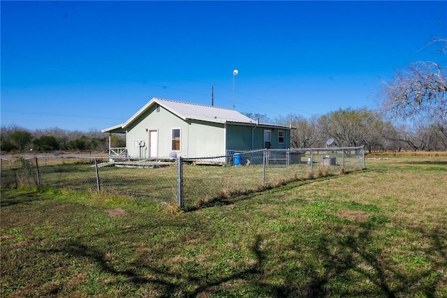 view of property exterior with a lawn