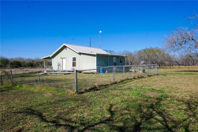 view of property exterior with a lawn