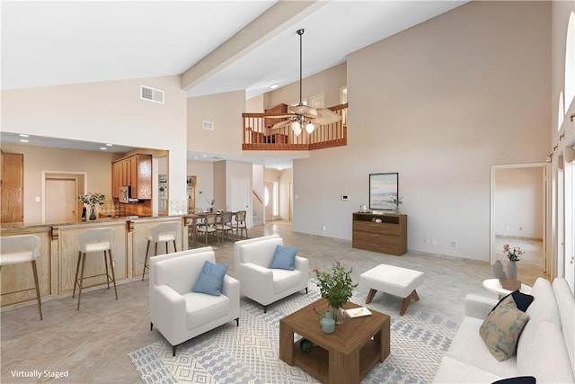 living room featuring visible vents, high vaulted ceiling, and ceiling fan