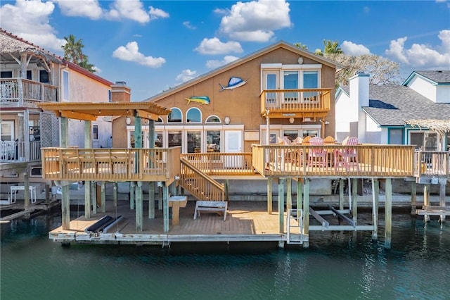 view of dock with a deck with water view and boat lift