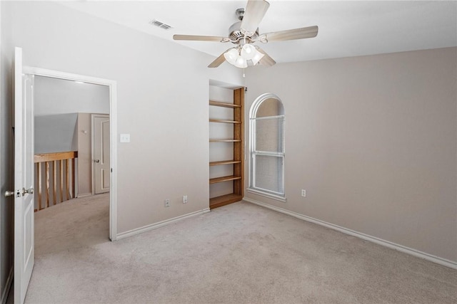 unfurnished bedroom featuring baseboards, ceiling fan, visible vents, and carpet flooring