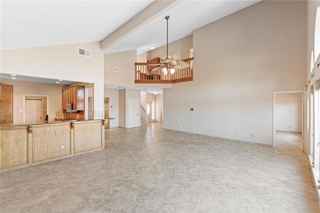 unfurnished living room featuring high vaulted ceiling, ceiling fan, visible vents, and beamed ceiling