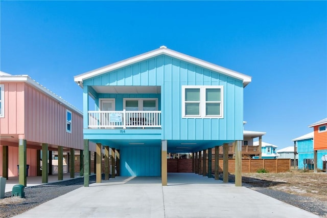 coastal home with a carport and a balcony