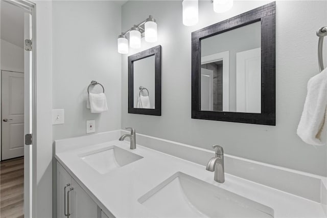 bathroom featuring vanity and hardwood / wood-style flooring