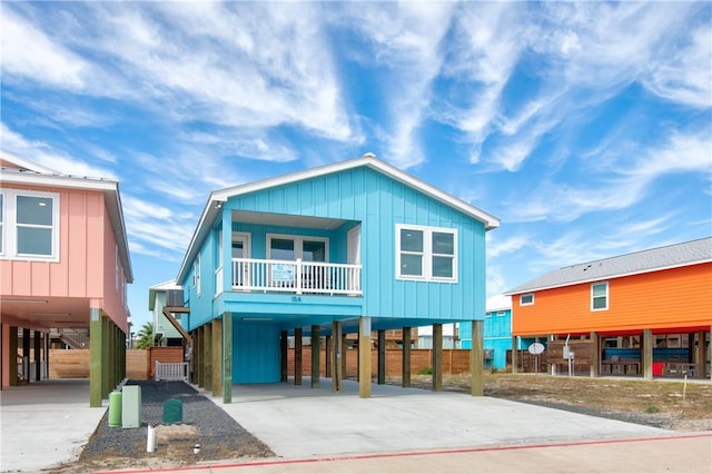 view of front of property featuring a carport and a balcony