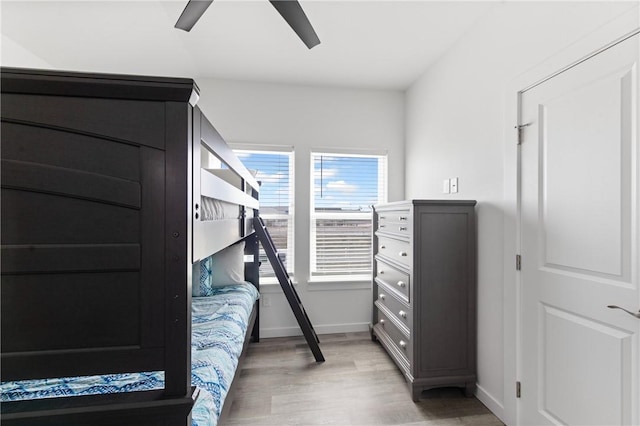 bedroom with hardwood / wood-style flooring and ceiling fan