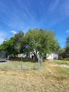 view of yard with a trampoline